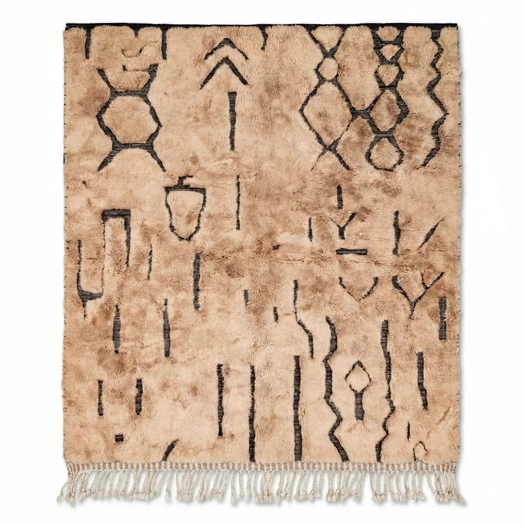 Tribal Treasures Custom Moroccan Rug Beni Mrirt - Hand-knotted beige wool rug with black abstract tribal symbols and high pile texture